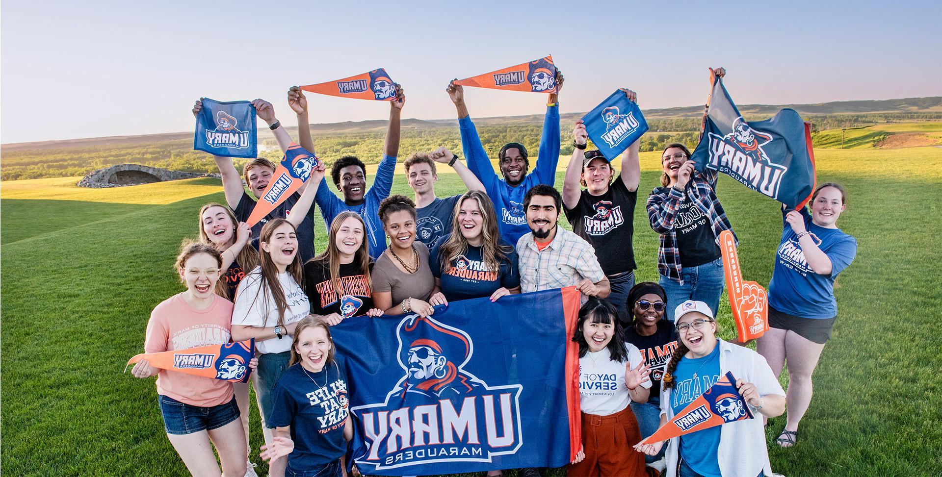 Students on the lawn with flags